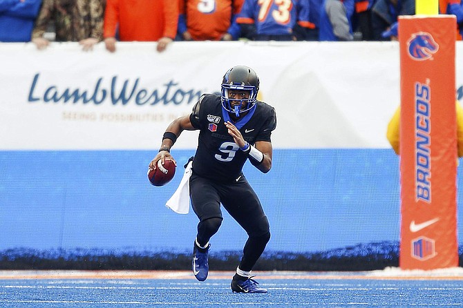 Boise State quarterback Jaylon Henderson on the blue turf during the Mountain West Championship on Dec. 7. Nevada has had little success in Boise, even when it has played a team not named Boise State.