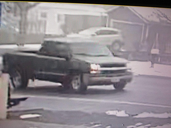 The suspect vehicle in a hit and run is seen driving north on Airport Road.