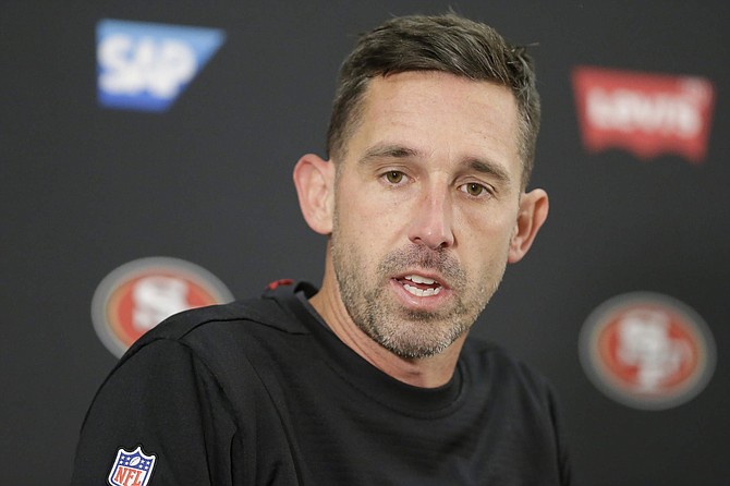 San Francisco 49ers head coach Kyle Shanahan speaks during a news conference after loosing to the Baltimore Ravens in a NFL football game, Sunday, Dec. 1, 2019, in Baltimore, Md. Ravens won 20-17. (AP Photo/Julio Cortez)