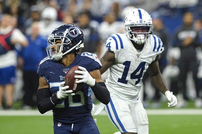 Tennessee Titans cornerback Logan Ryan (26) intercepts a pass intended for Indianapolis Colts wide receiver Zach Pascal (14) during the second half of an NFL football game in Indianapolis, Sunday, Dec. 1, 2019. (AP Photo/AJ Mast)