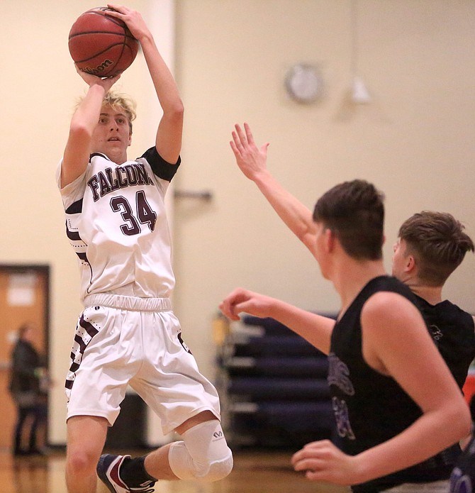 Luke Schinzing lofts up a fadeaway jumper Thursday evening in Sierra Lutheran&#039;s contest against Redding Christian. Schinzing finished the night with a team-high 13 points. 