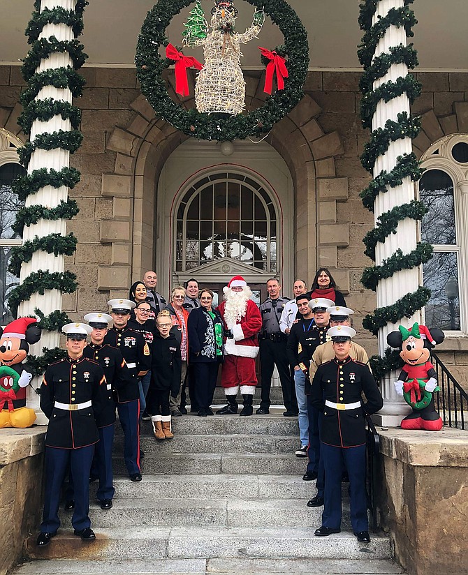 Representatives from the Marine Corp., Nevada Department of Public Safety, Legislative Police, Joyce Buckingham, Toys for Tots executive director, and Santa on the steps of the Capitol on Tuesday.