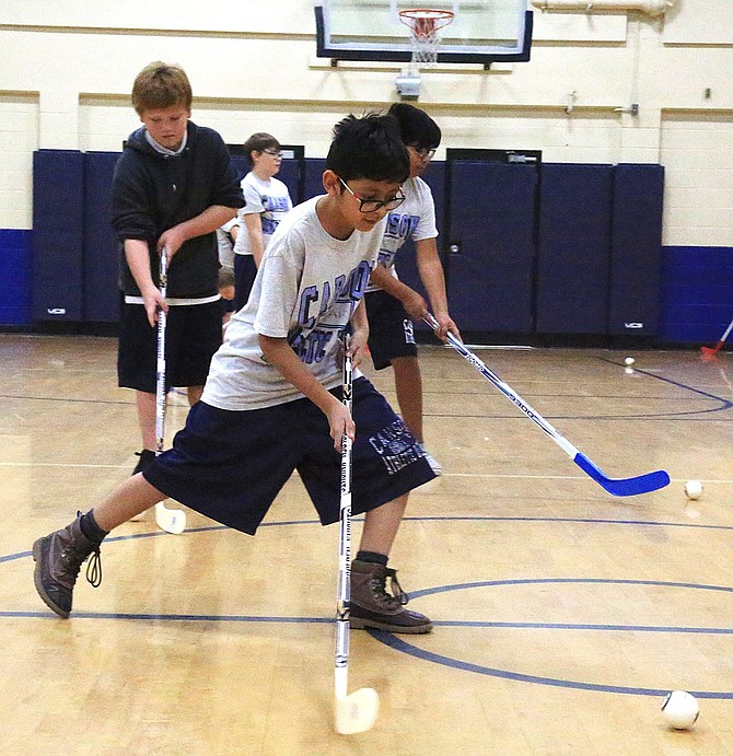 Sixth-grader Iker Lozano takes a shot during a Las Vegas Golden Knights clinic on Friday