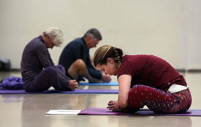 Instructor Adria White leads a Wellness Yoga session on Dec. 16 at the Carson City Community Center. The free series, sponsored by Partnership Carson City, encourages participants to take control of pain management through weekly yoga.