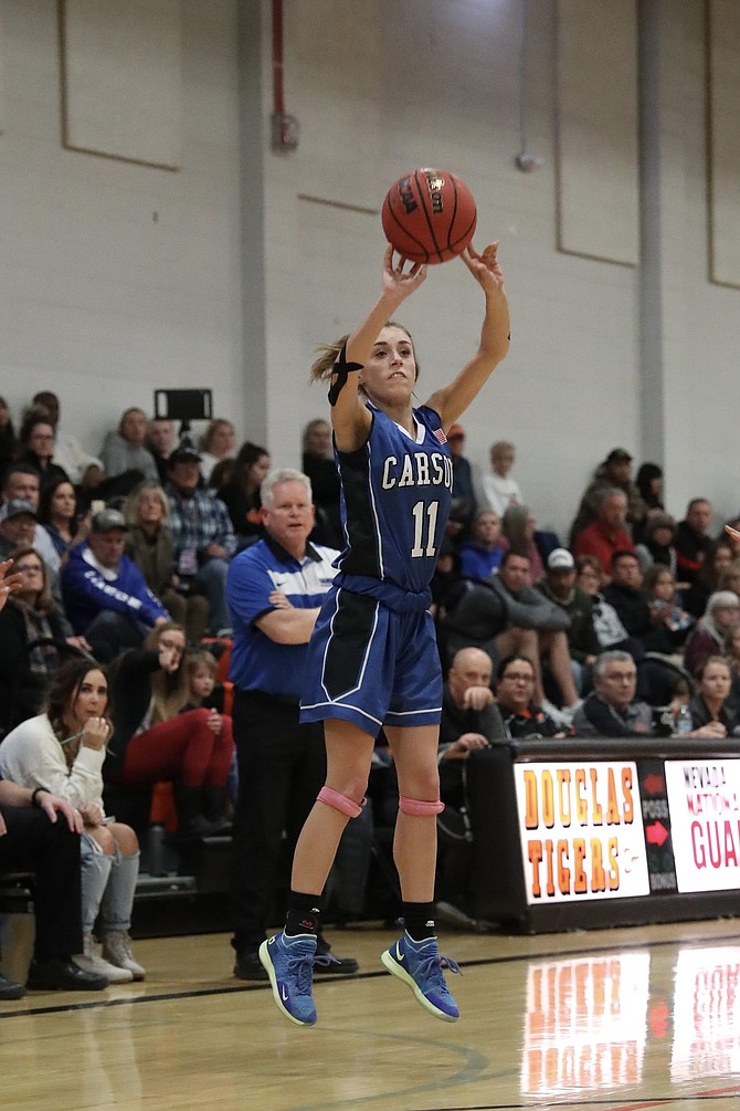 Abby Golik shoots a 3-pointer during the third quarter in which she hit two triples. Golik ended the night with 11 points as Carson bested Douglas 47-33. 