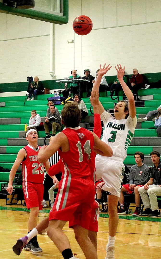 Avery Strasdin (3) scores his third basket for Fallon in the first quarter of the Greenwave&#039;s game against Truckee.