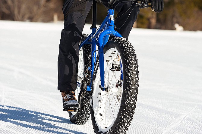 Fat bikes are bikes with over-sized tires at least 4 inches wide that are designed for low ground pressure to allow for riding on soft unstable terrain, like snow.
