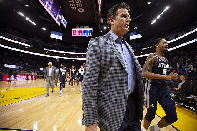 Nevada head coach Steve Alford walks off the court at halftime against Saint Mary&#039;s on  Dec. 21 in San Francisco.