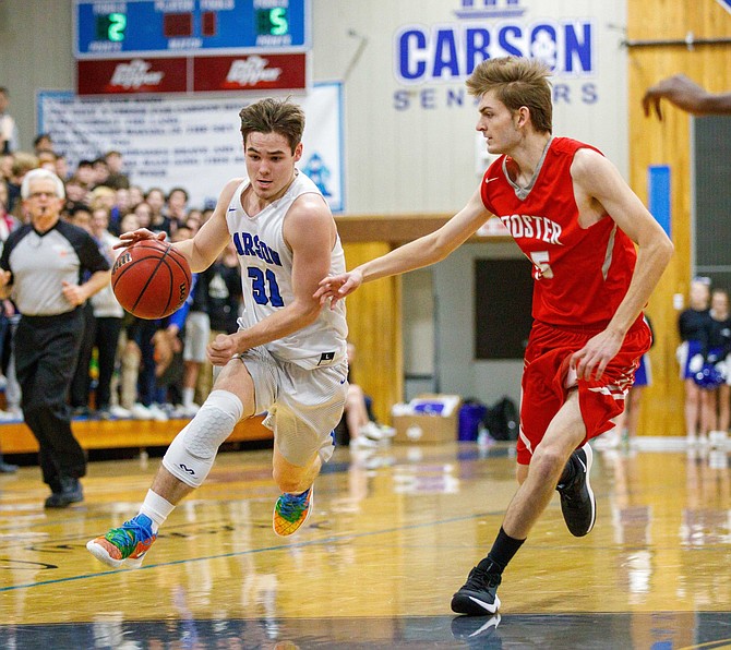 Carson High forward Nathan Smothers drives toward the key during the NIAA Northern Division 4A game between the Wooster Colts and Carson Senators at Carson High School, Carson City, NV