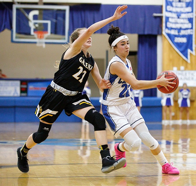 Carson High Guard Lily Bouza drives to the basket during the NIAA Northern Division 4A game between the Galena Grizzlies and Carson Senators at Carson High School. 