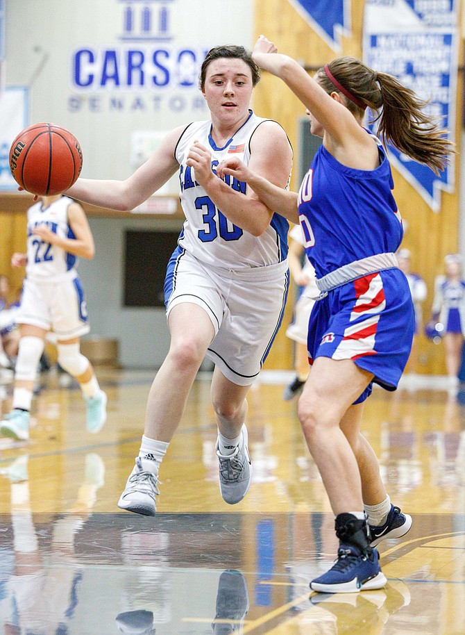 Carson High&#039;s Camryn Quilling drives to the hoop during the NIAA Northern Division 4A game between the Reno Huskies and Carson Senators at Carson High.