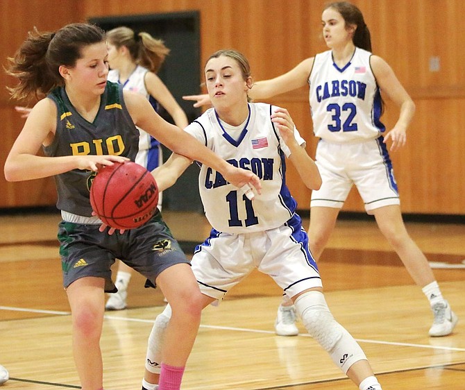 Abby Golik pokes away a steal in a Senator girls basketball game earlier this season. Golik and company have allowed just 38.7 points per game this season while forcing an average of 19.5 steals per game.