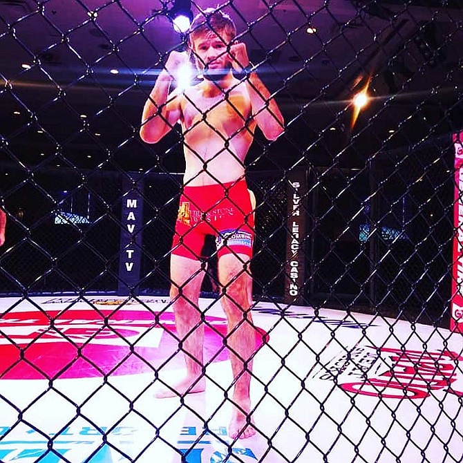 Brady O&#039;Keefe poses for a photo during his first appearance at King of the Cage Reno.