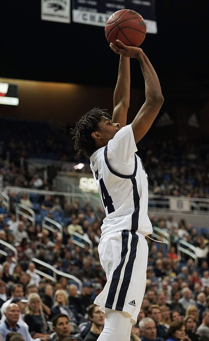 Nevada&#039;s Lindsey Drew hits a 3-pointer in the first half against Texas Southern as he finishes with a double-double.