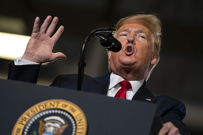 FILE- In this Jan. 28, 2020, file photo, President Donald Trump speaks during a campaign rally at the Wildwoods Convention Center Oceanfront in Wildwood, N.J. Trump will be facing his accusers Tuesday night during his State of the Union speech. The impeached president is speaking on the eve of what&#039;s anticipated to be his Senate acquittal on Wednesday. (AP Photo/ Evan Vucci, File)