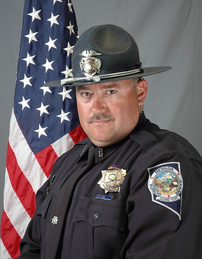 This undated photo provided by the Nevada Highway Patrol shows Sgt. Ben Jenkins, 47, a medal of valor winner who was shot and killed by a motorist early Friday, March 27, 2020, on U.S. 93 near Ely, Nevada. (Nevada Highway Patrol via AP)