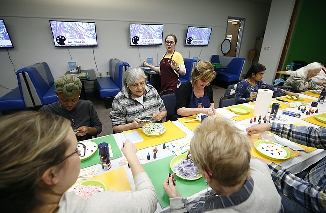 Library Assistant Jana Wiersma leads participants in a craft during Art Night Out at the Carson City Library, on Tuesday, Jan. 14, 2020. With the library closed to the public temporarily, those interested can still participate in many offerings virtually.