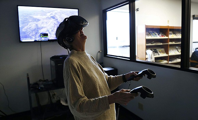 Barbara Pefley is introduced to virtual reality at the Carson City Library on Feb. 22, 2019.
