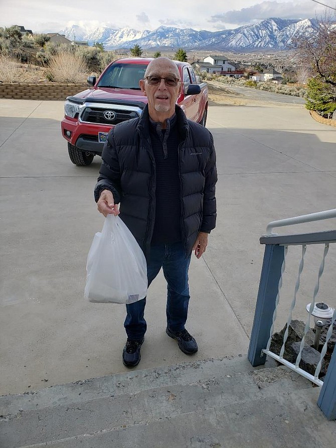 Purple Avocado owner Stan Jones provides breakfast from the Crackerbox to Carson City residents and friends Joe and Marge Dolan in quarantine on Tuesday. 