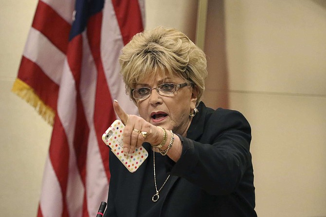 FILE - In this Nov. 6, 2019 file photo Las Vegas Mayor Carolyn Goodman points toward protesters during the council meeting where the city council was considering a ban on homeless camping in Las Vegas. The morning after Nevada Gov. Steve Sisolak declared he was nowhere near reopening parts of the state&#039;s idled economy.Goodman said &quot;I am asking: Open the city. Open Clark County. Open the state,&quot; 