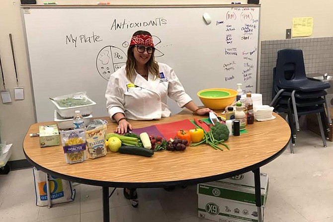 Extension Nutrition Specialist Susan McClain gives a cooking demonstration to Richard J. Rundle Elementary School students in Las Vegas.