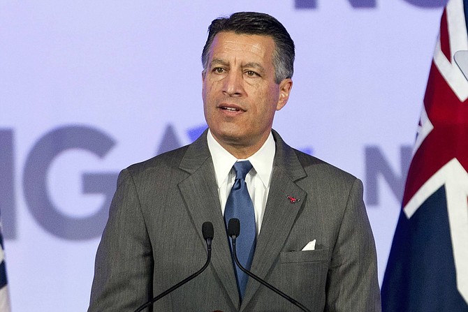 FILE - This Feb. 24, 2018, file photo shows then-Gov. Brian Sandoval of Nevada at the National Governor Association 2018 winter meeting in Washington, D.C. 