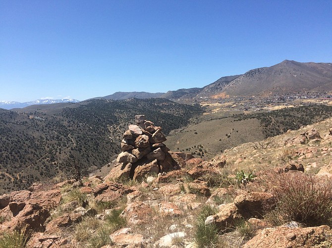 A cairn marks a high point in the wilderness area off 6 Mile Canyon Road in Storey County. Virginia City can be seen in the background.