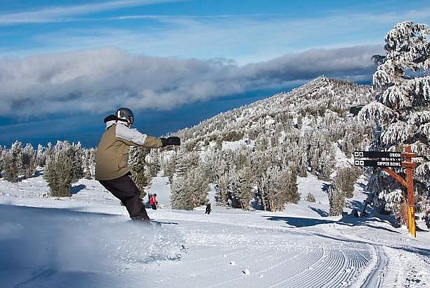 A snowboarder makes turns in January 2019 at Heavenly Mountain Resort on Lake Tahoe&#039;s South Shore. Heavenly is one of three Vail Resorts-owned ski areas in the greater Reno-Tahoe region.

