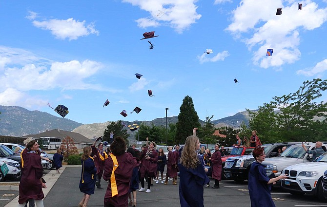 Sierra Lutheran High School&#039;s Class of 2020 tosses its caps in celebration after graduating Saturday. Jessica Garcia/Nevada Appeal