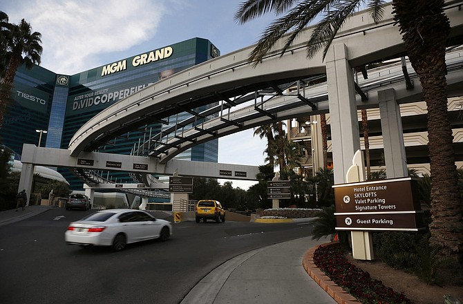 FILE - In this Jan. 14, 2016, file photo, cars drive into the MGM Grand hotel and casino in Las Vegas. Casino giant MGM Resorts International says it won&#039;t charge parking fees at its Las Vegas Strip resorts when they are allowed to reopen after being closed due to the coronavirus pandemic. No reopening date has been set. But a spokesman for the owner of properties including Bellagio, MGM Grand, New York-New York and Mandalay Bay says in a statement Tuesday, May 19, 2020, that free parking will be a way to welcome guests back. 