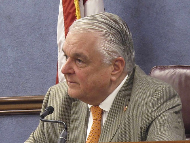 Nevada Gov. Steve Sisolak listens to a reporter&#039;s question during a news conference in Carson City, Nev., Thursday, May 7, 2020, after Sisolak announced that Nevada will begin allowing restaurants, salons and other non-essential businesses to reopen starting Saturday. It&#039;s the first easing of restrictions imposed in Nevada seven weeks ago to stop the spread of the coronavirus. Casinos are among businesses that will remain closed for now. (AP Photo/Scott Sonner)