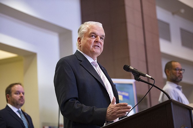 Nevada Gov. Steve Sisolak discusses measures to help the public with housing stability amid the COVID-19 public health crisis at the Grant Sawyer Building in Las Vegas, Sunday, March 29, 2020. (Rachel Aston/Las Vegas Review-Journal via AP, Pool)
