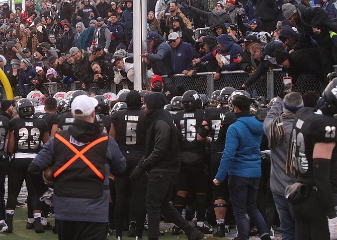 Fans in the south end zone at Mackay Stadium get involved in a fight between Nevada and UNLV players at the end of a game Nov. 30.