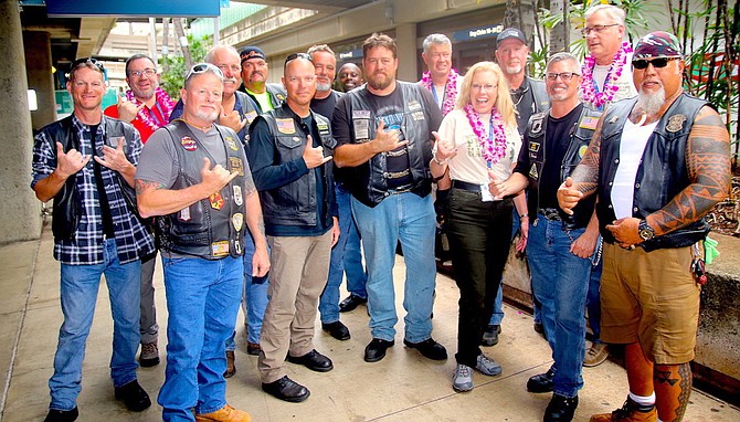 Veterans from various motorcycle clubs in the Honolulu area and members of the Honor Flight Nevada board of directors meet at the Daniel K. Inouye International Airport. The veterans provided an escort for HNF to their downtown hotel.