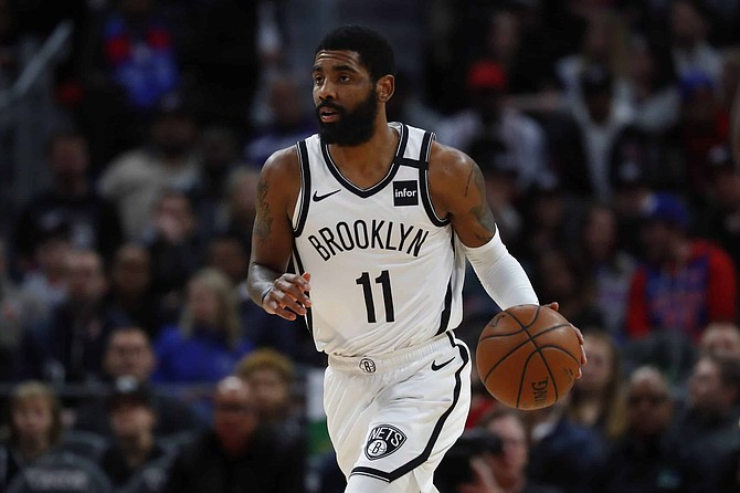 Brooklyn Nets guard Kyrie Irving plays against the Detroit Pistons in the first half of an NBA basketball game in Detroit, Saturday, Jan. 25, 2020. 