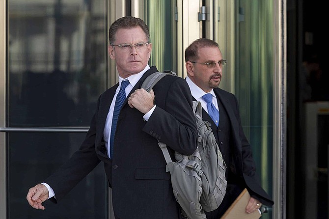 FILE - In this Nov. 19, 2019, file photo, Douglas Haig, left, and his attorney, Marc Victor leave the Lloyd George Federal Courthouse in Las Vegas, after pleading guilty to illegally manufacturing tracer and armor-piercing bullets found in a high-rise hotel suite where a gunman took aim before the Las Vegas Strip massacre two years ago. Haig is a 57-year-old aerospace engineer who used to reload bullets at home in Mesa, Airz., and sell them at gun shows. Douglas Haig has been sentenced to 13 months in federal prison after selling home-loaded bullets to the gunman who killed 58 people in the Las Vegas Strip shooting in Oct. 2017. Haig, 57, also was sentenced Tuesday, June 30, 2020, in Las Vegas to three years of supervised release after pleading guilty last November to illegally manufacturing ammunition. 