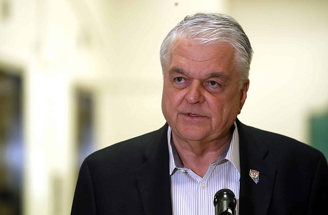 Nevada Gov. Steve Sisolak speaks during a news conference at the Sawyer State Building in Las Vegas,Tuesday, March 17, 2020. Sisolak ordered a monthlong closure of casinos and other non-essential businesses in order to stem the spread of the new coronavirus (COVID-19). (Steve Marcus/Las Vegas Sun via AP)