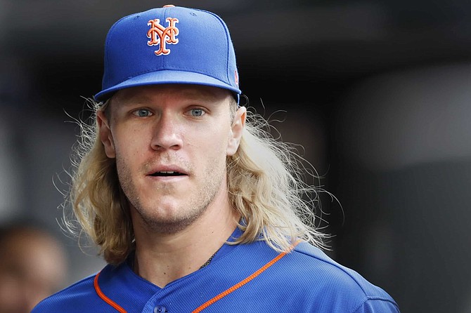 New York Mets starting pitcher Noah Syndergaard is shown in the Mets&#039; dugout after pitching seven innings in a baseball game against the Atlanta Braves, Sunday, Sept. 29, 2019, in New York. (AP Photo/Kathy Willens)
