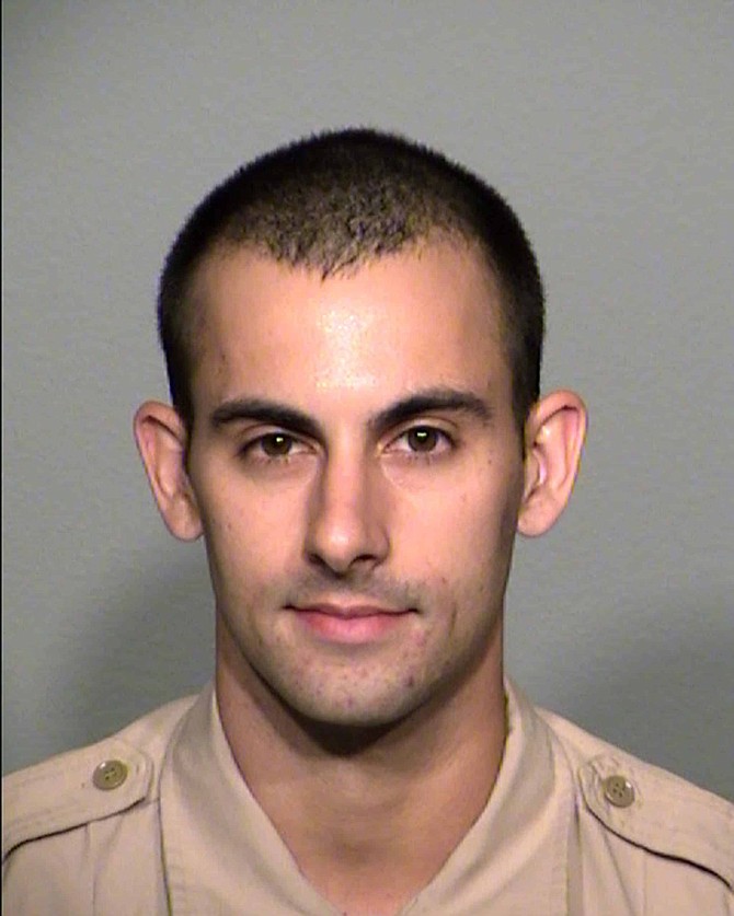 FILE - A file photo provided by the Las Vegas Metropolitan Police Department shows officer Shay Mikalonis.  Mikalonis, who was shot in the head during a Las Vegas Strip protest of the death of George Floyd in Minneapolis, is paralyzed from the neck down, on a ventilator and unable to speak, his family said in a statement released by police. 