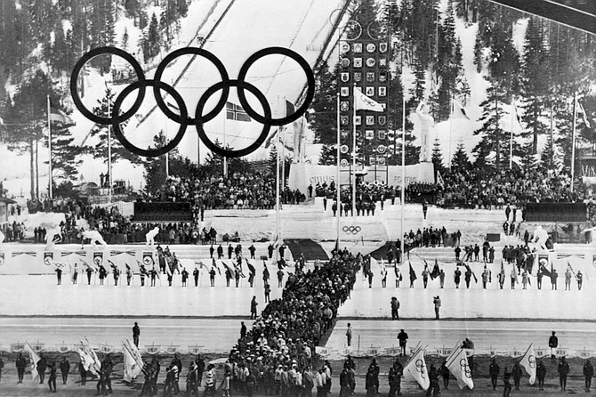 FILE - In this Feb. 28, 1960, file photo, Olympic athletes march into Blyth Arena at Squaw Valley for the ceremony to end the Winter Olympic Games in Olympic Valley, Calif. California&#039;s Squaw Valley Ski Resort is considering changing its name to remove &quot;squaw,&quot; a derogatory term for Native American women. Squaw Valley President &#038; CEO Ron Cohen says resort officials are meeting with shareholders and the local Washoe tribal leadership to get their input. He says he can&#039;t give a timeline on when the decision will be made. The renaming of Squaw Valley Ski Resort is one of many efforts across the nation to address colonialism and indigenous oppression. 