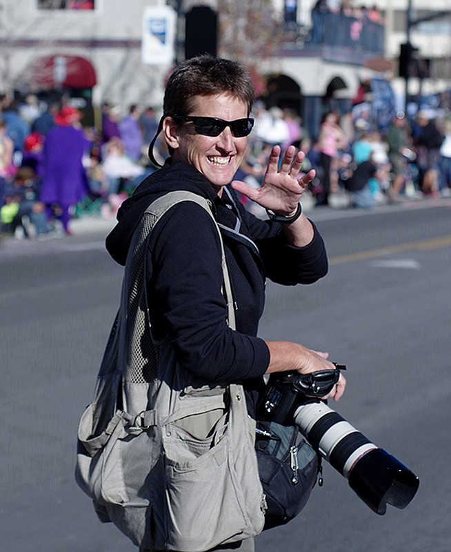 Northern Nevada photographer Cat Allison works the Nevada Day parade in 2017. A fixture in the community for decades, Allison is retiring but will continue to make images and attend community events. 

