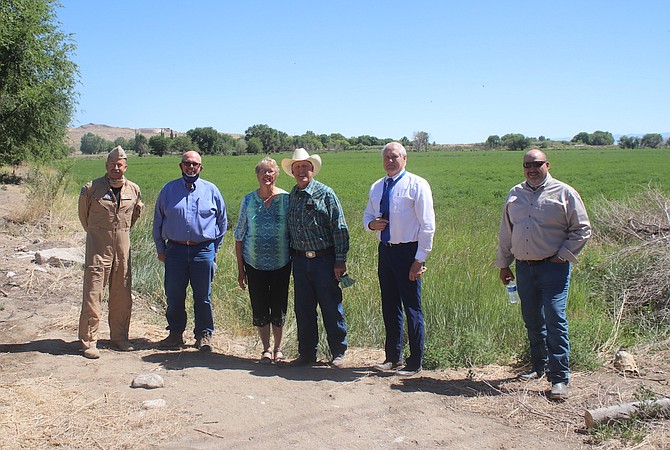 The conservation easement program has been a win-win for ranchers, Churchill County and Naval Air Station Fallon. From left are&#160; Capt. Evan Morrison, commander, Naval Air Station Fallon; Pete Olsen chairman of the Churchill County Board of Commissioners; Carmen and Ernie Schank; Rusty Jardine, general manager and counsel of Truckee Carson Irrigation District; and Jim Barbee, county manager.