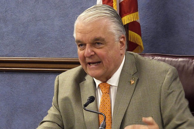 FILE - In this May 7, 2020, file photo, Nevada Gov. Steve Sisolak speaks during a news conference in Carson City, Nev. Sisolak on Monday, July 20, 2020, signed five bills passed by the Legislature restoring some of the $536 million in cuts the governor outlined in his proposed budget and creating a federally funded grant program for schools facing coronavirus expenses. (AP Photo/Scott Sonner, File)