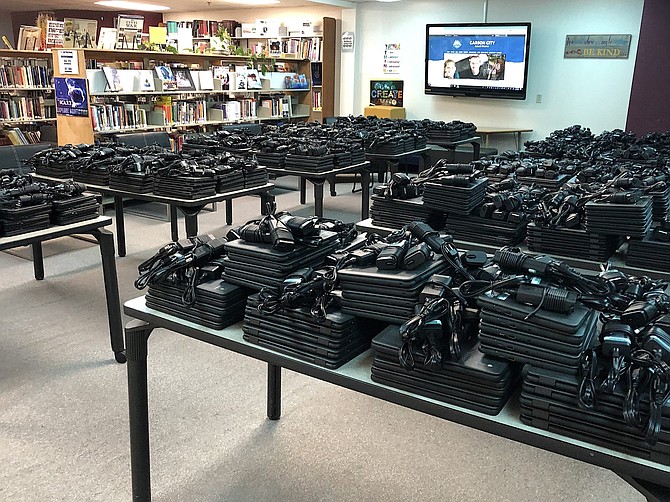 The Carson City School District has prepared a batch of Chromebooks for distribution to students this week in the Carson High School library. Students are assigned a laptop to use at home for their studies and provided an e-mail account to communicate with their teachers.

