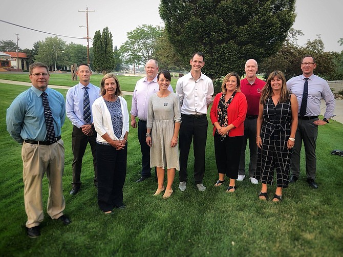 From left, Cody Farnworth, Bob Chambers, Sue Moulden, Dan Brown (principal at Fritsch Elementary School), Gina Hoppe, Nathan Brigham, Amy Robinson, Lee Conley (principal at Eagle Valley Middle School), Susan Desrosiers and Dan Sadler (principal at Carson Middle School). Not pictured: Steven Nelms. 
