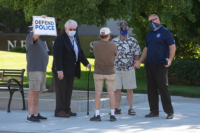 Assemblyman John Hambrick joins protestors outside the Legislature on Saturday, Aug. 1, 2020 during the second day of the 32nd Special Session in Carson City. 