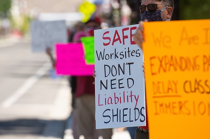Protesters rally against liability protections for employers relating to COVID-19 on Saturday, Aug. 1, 2020 outside the Legislature on the second day of the 32nd Special Session in Carson City. 