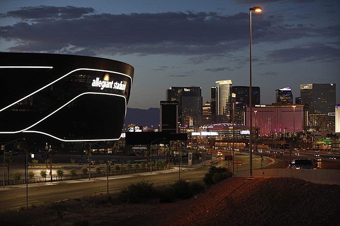 Lights adorn Allegiant Stadium, new home of the Las Vegas Raiders football team, as it nears completion Wednesday, July 22, 2020, in Las Vegas. The stadium will also serve as the home for the UNLV football team. 