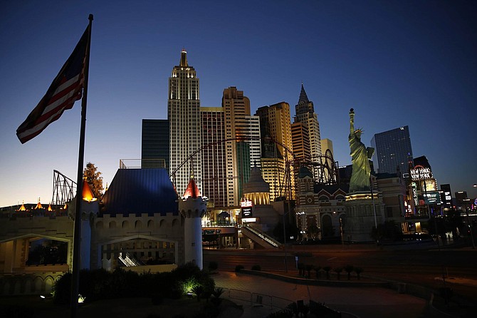 FILE - In this April 28, 2020, file photo, the sun sets behind casinos and hotels along the Las Vegas Strip in Las Vegas. With authorities investigating the latest shooting outside a Las Vegas Strip resort, police reported Wednesday, Sept. 23, 2020, that a spike in violent crime in and around the city&#039;s marquee tourist area has led to at least 1,100 arrests since Aug. 1 and the seizure of more than 60 weapons. 
