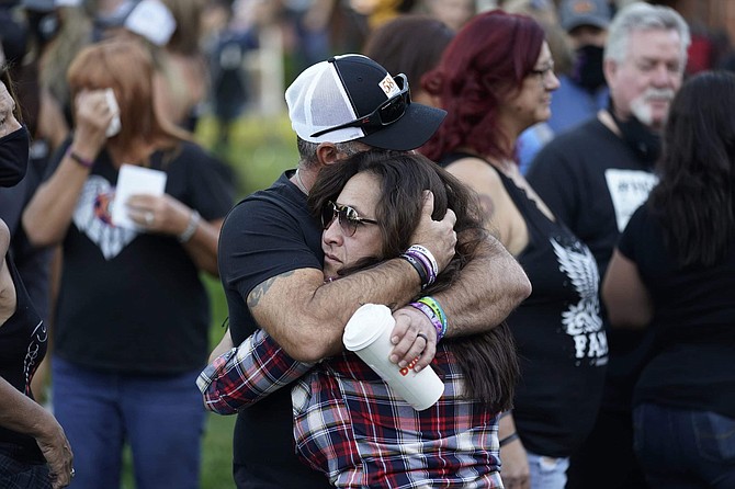 Jimmy Long, left, embraces Debby Allen, mother of victim Christopher Roybal, during a ceremony Thursday, Oct. 1, 2020, on the anniversary of the mass shooting three years earlier in Las Vegas. The ceremony was held for survivors and victim&#039;s families of the deadliest mass shooting in modern U.S. history. 